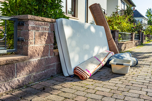 Bulk garbage day concept, miscellaneous rubbish items put on a street for council bulk waste collection, bulky waste and waste management