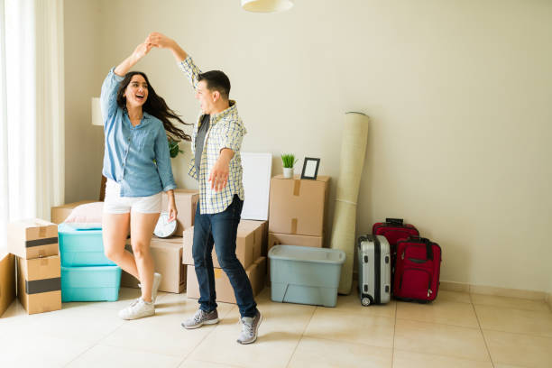 istock Romantic couple celebrating moving into a new house and dancing 1618687503