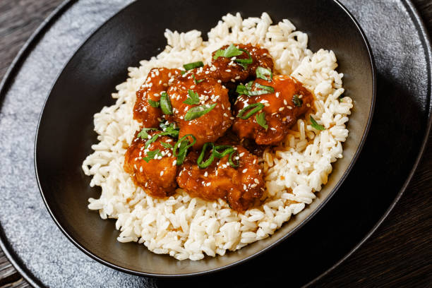 istock Baked Honey Sesame Chicken with brown rice 1618719463