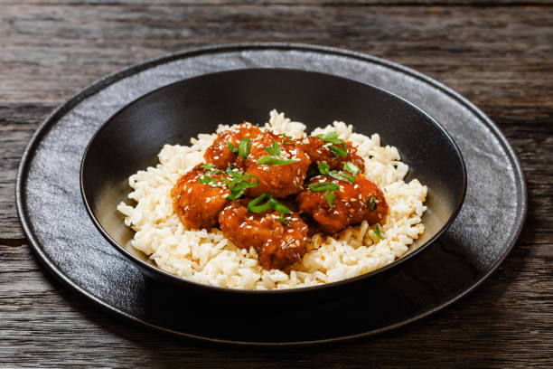 istock Baked Honey Sesame Chicken with brown rice 1618719468