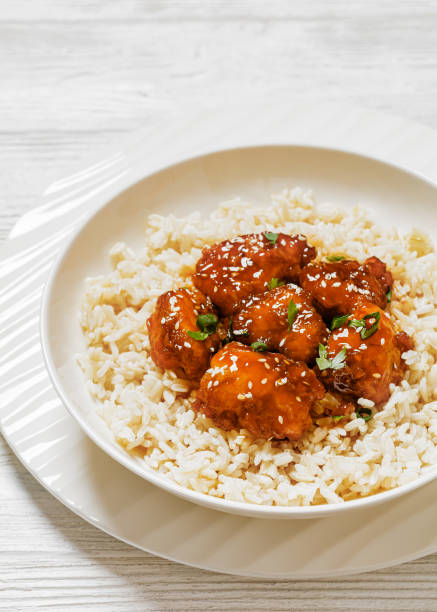 istock Baked Honey Sesame Chicken with brown rice 1618726289