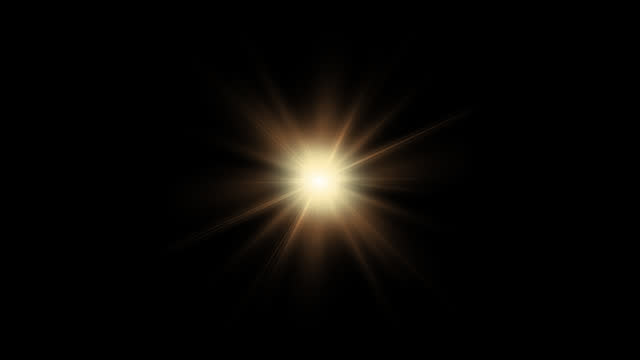 Golden star on transparent background. Glowing light effect on black background for Screen blend mode