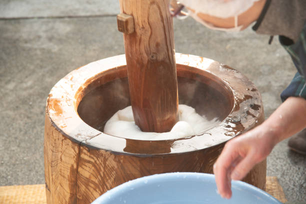 istock Mochitsuki, rice cake making by traditional style in Japan 1618742220