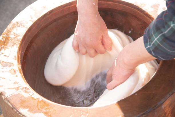 istock Mochitsuki, rice cake making by traditional style in Japan 1618742236