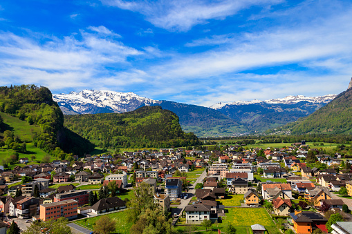 View on Saanen,a municipality in the canton of Bern,Switzerland.In the background the village of Gstaad,a famous skiing resort.