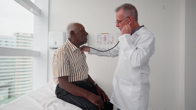 Portrait of a doctor listening to a patient's heartbeat