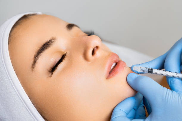 istock Beauty injection for lip augmentation in a beauty salon 1618763560