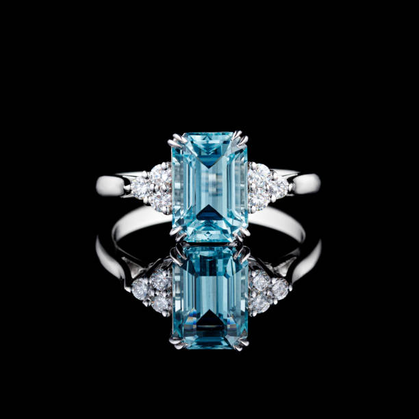istock beautiful white gold ring with diamonds and aquamarine on a black background 1618778906