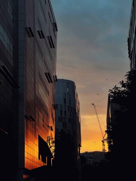 istock Sunset colors reflecting from a building facade 1618792070