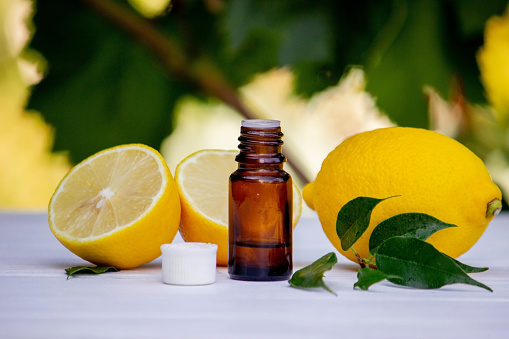 lemon oil in jars, fresh lemon. Selective focus. Nature