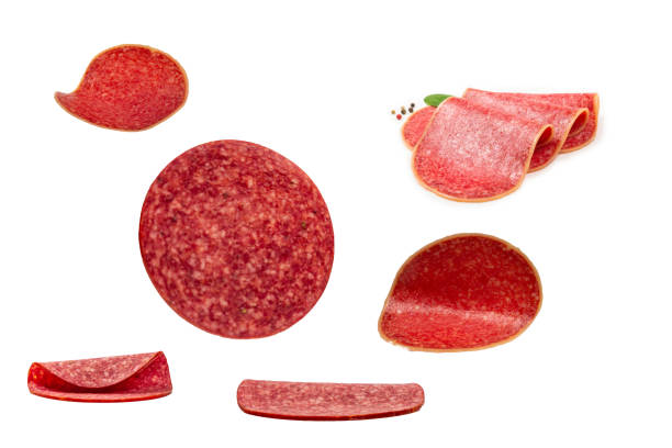 istock Falling tasty salami isolated on white 1618823471