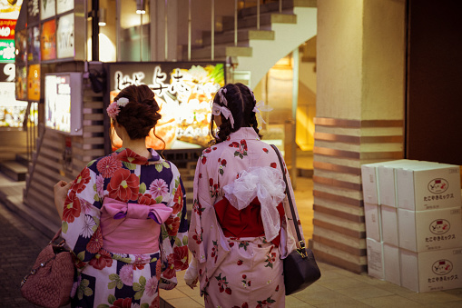 August 6, 2019: Women in kimonos on the street of Kabuki-who in Tokyo
