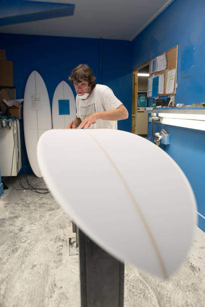 istock Professional surf shaper in action in his studio 1618840208