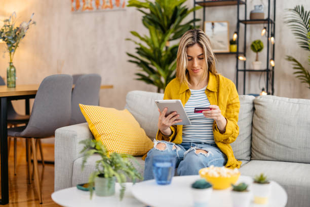 istock Woman Shopping Online Using Digital Tablet At Home 1618846962