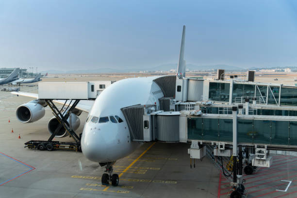 istock Pre-flight and refueling and Loading cargo service of airplane, Airplane's prepare for take-off in gate, terminal international airport. view through window 1618858846