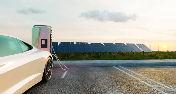 istock Electricity car charging with solar panel at sunset time 1618859362
