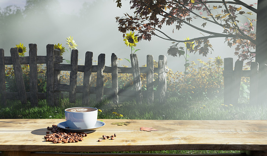 Hot latte coffee on old wooden table in sunflowers garden with fog clouds and autumn tree morning light scene, 3d illustration rendering