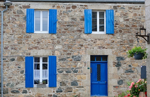 Blue is a typical color for shutters and doors in Brittany