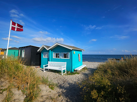 small idyllic beach shed at the waterfront