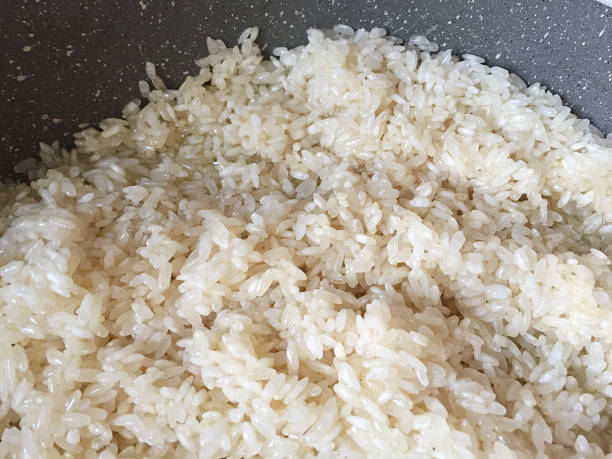 istock Cooking rice in a saucepan, pilau rice 1618898323