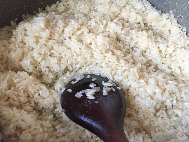 istock Cooking rice in a saucepan, pilaf 1618898332