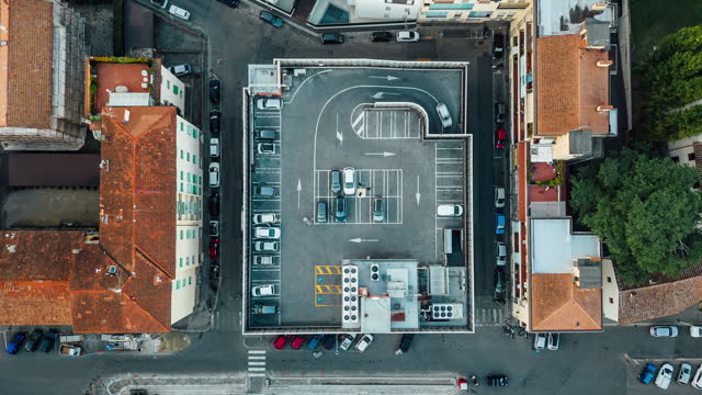 Aerial time lapse of a rooftop parking in the city