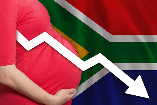 Pregnant woman on flag of  South African Republic background. Falling fertility rate