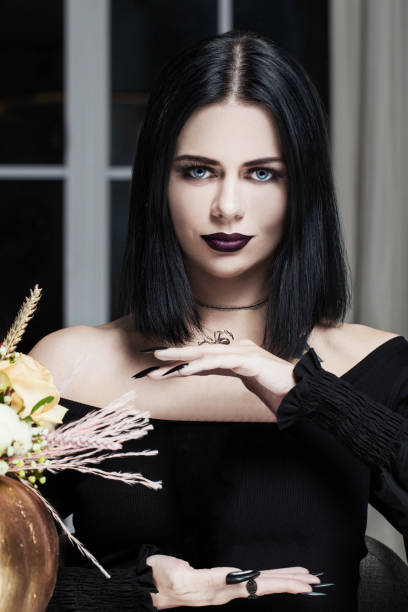 istock Brunette woman, soothsayer or witch with empty hands looking at camera 1618928801