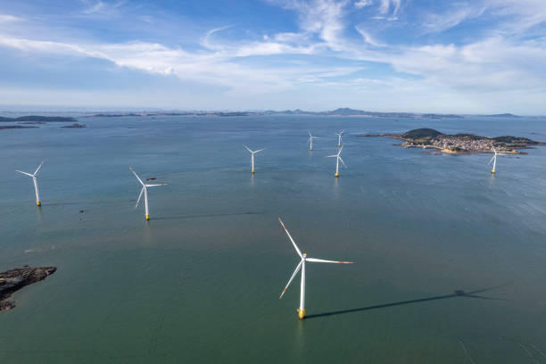istock Wind turbines at sea on sunny day 1618941942