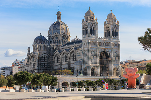 A scenics view of the cathédrale Sainte-Marie-Majeure (La Major) under a majestic blue sky and some white clouds on March 24, 2023 in Marseille, bouches-du-rhône, France