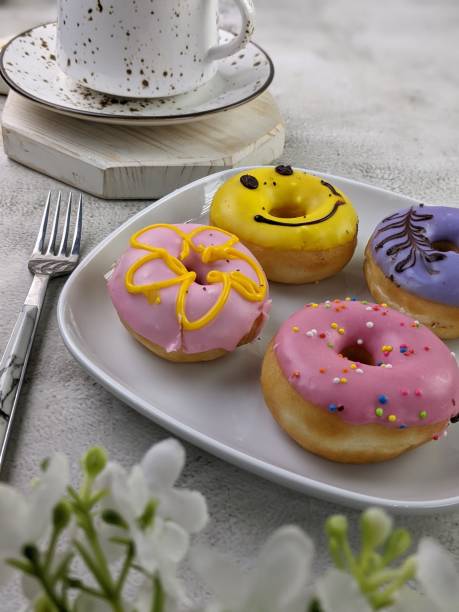 istock close up and selective focus of decorative doughnut in the box 1618962852
