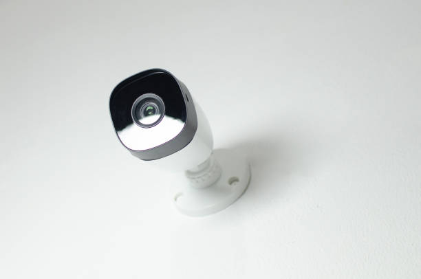 istock Close-up of a white security camera, representing the constant presence of an electronic guardian to protect and monitor spaces. 1619018667