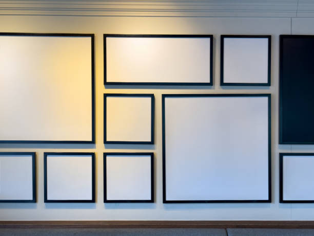 istock A Wall of Memories: Black, White, and Gray Picture Frames on a White Wall 1619019215