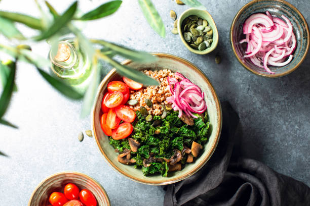 istock Kale and mushrooms vegan bowl, overhead view 1619023067