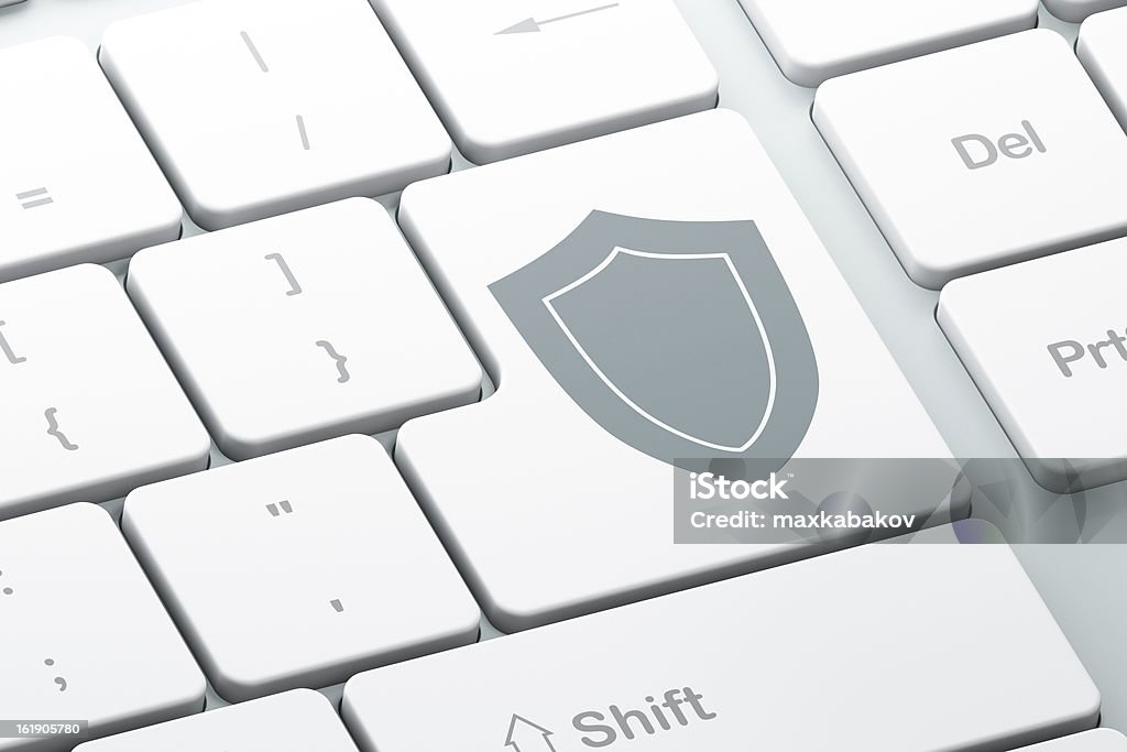 Enter button with shield on computer keyboard Enter button with shield on computer keyboard, 3d render Close-up Stock Photo