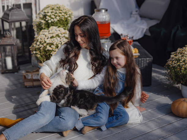 istock small happy family celebrating Thanksgiving. 1619064776