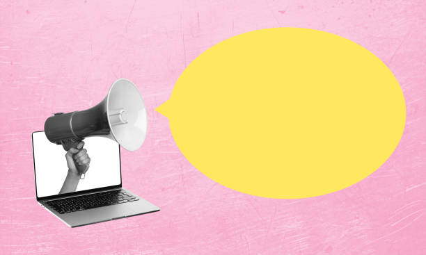 istock Art collage, laptop, and megaphone on pink background with copy space. 1619081990