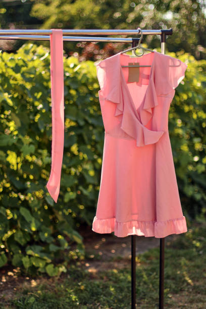 istock Stylish, fashionable summer dress on a hanger. 1619087364