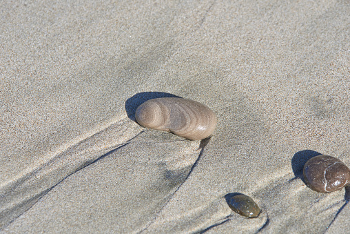 stones,pebbles on sandy ocean beach