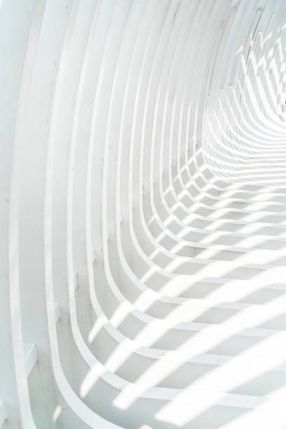 istock white curved architecture exterior with highlight and shadows. 1619109783