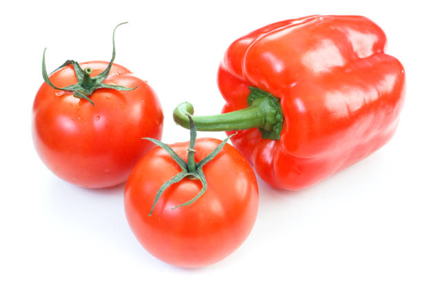 istock Fresh tomatoes and sweet pepper. Red vegetables isolated on white background. 1619117828