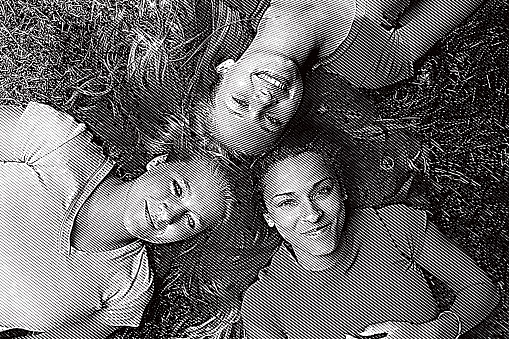 Three best friends lying on backs looking up at camera