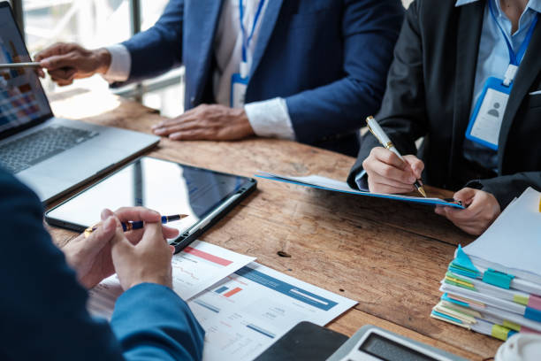 istock Business team analyzing income charts and graphs with modern laptop computer. Close up.Business analysis and strategy concept. 1619178902