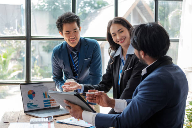 istock Business team analyzing income charts and graphs with modern laptop computer. Business analysis and strategy concept. 1619192198