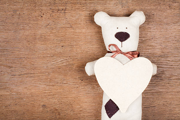 istock Valentine heart with handmade bear on wood background 161919327