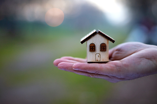 holding a house  Key with model House