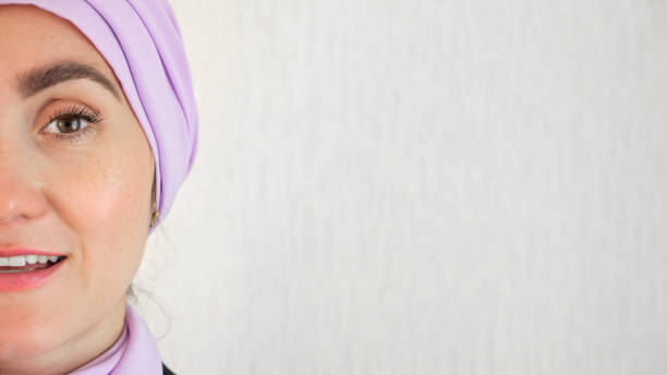 istock Muslim woman standing with delighted expression at wall 1619205052