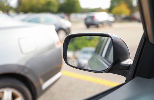 istock Car mirror: Reflection of journey, introspection, and transitions in a compact frame, capturing the road of life 1619222234