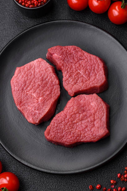 istock Juicy fresh raw beef meat with salt, spices and herbs 1619229185