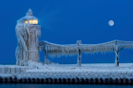 Ice accumulates on the St. Joseph North Pier Lighthouse in Saint Joseph, Michigan